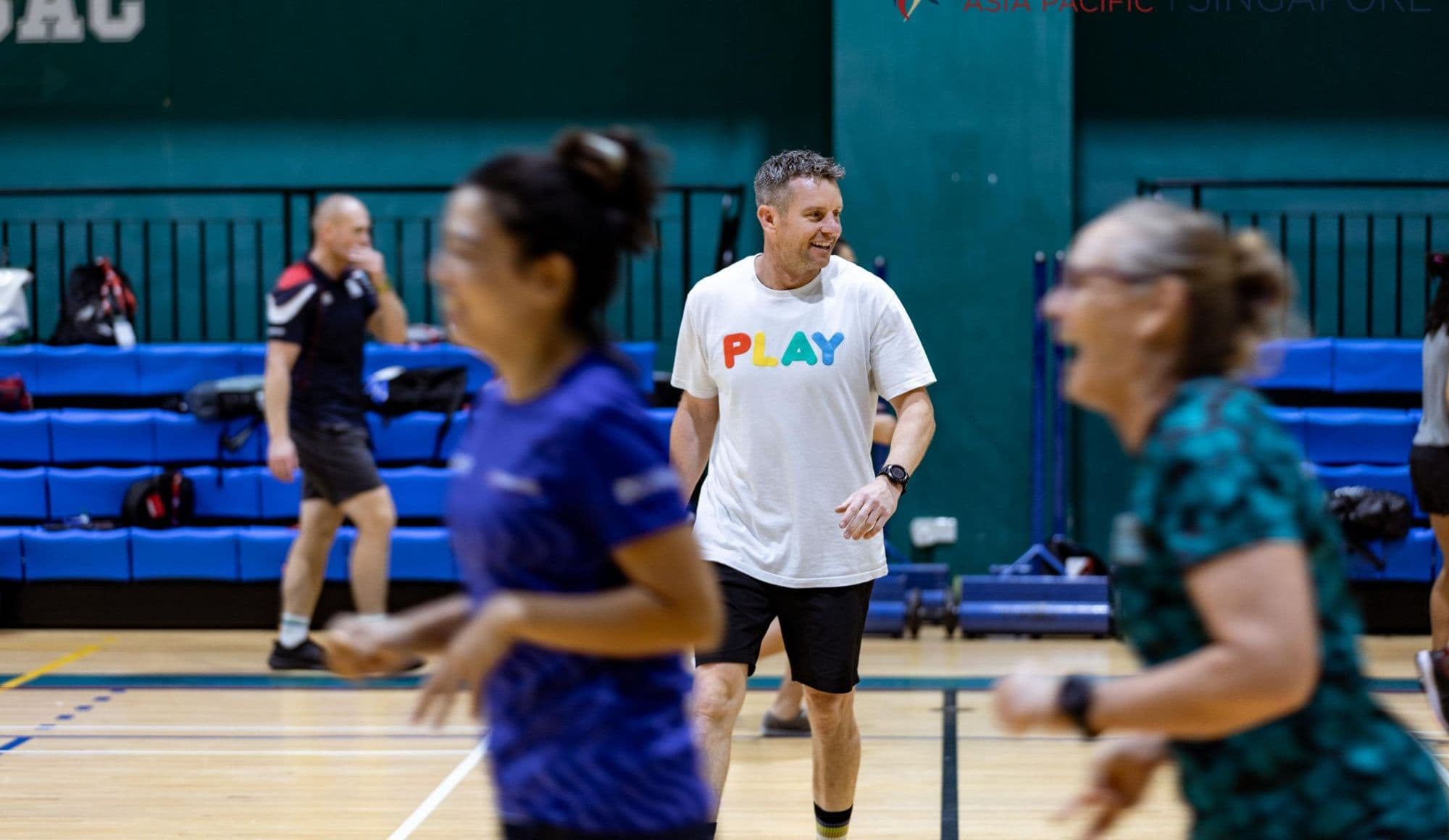Two people laughing as they run in a game