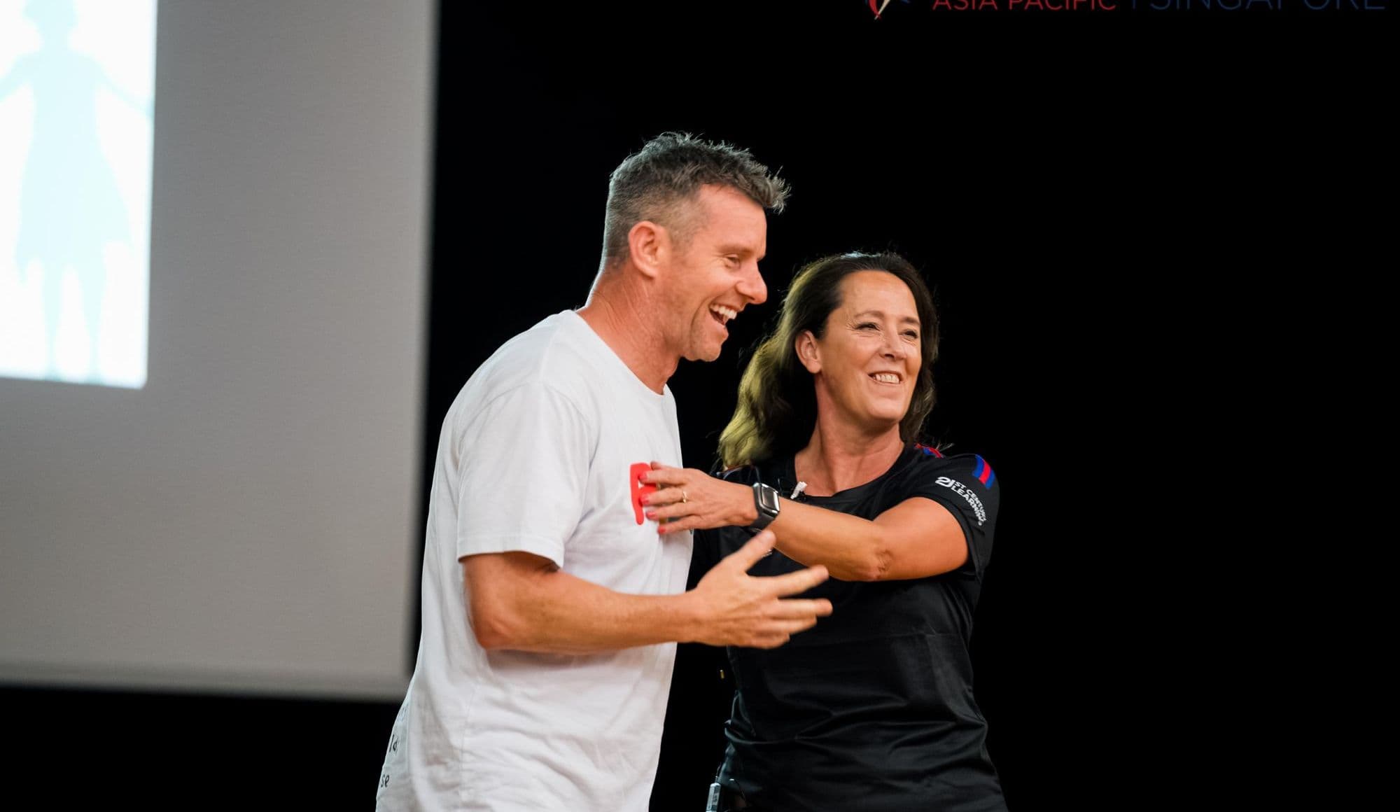 A Better Us facilitator sharing a laugh with a participant