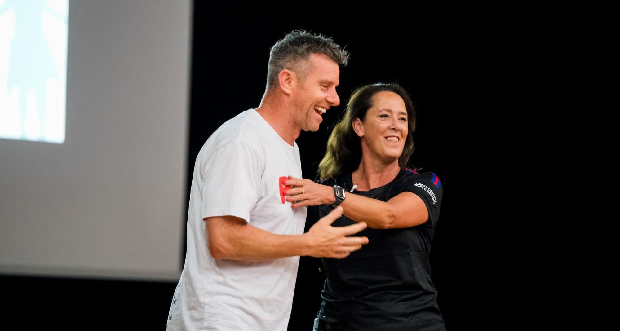 A Better Us facilitator sharing a laugh with a participant