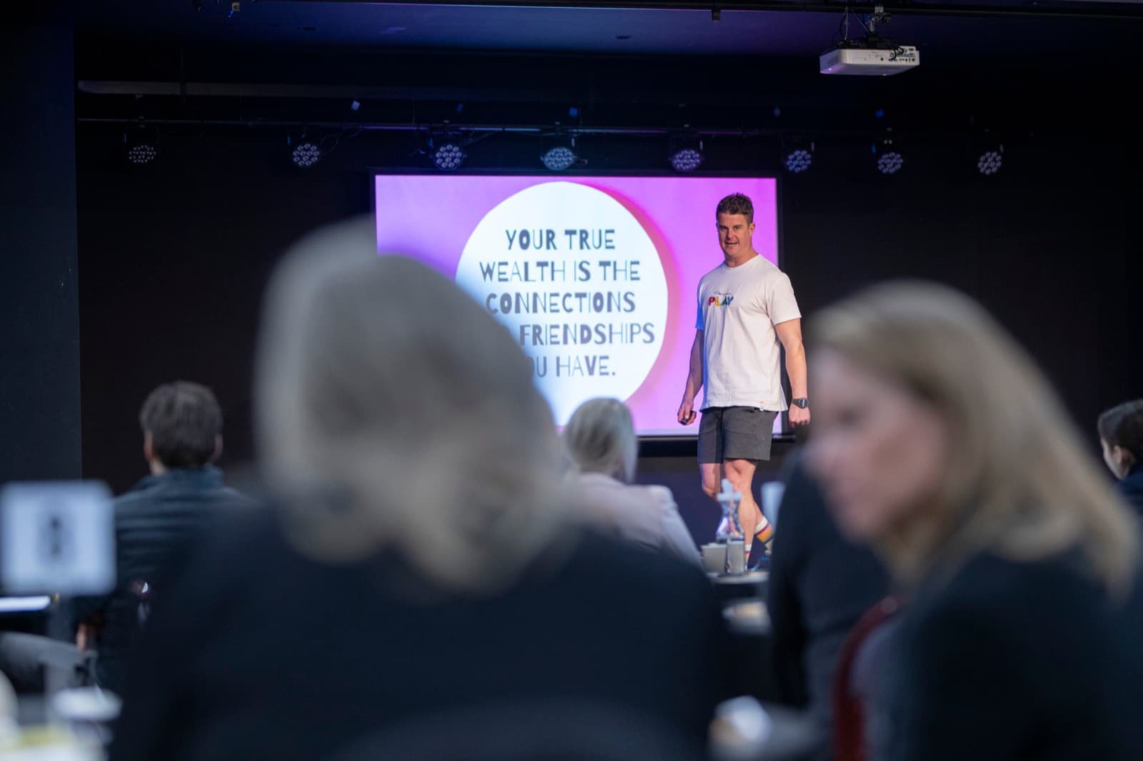 Presenter delivering a session on stage